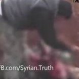  Organization-for-Defending-Victims - Syria rebel cuts out soldier's heart and eats it