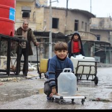  S-AZ-united-nations - Syria: UN provides emergency water around Aleppo, as 1.8 million cut off from water supply [In east Aleppo City, Syria, boys and a man collect water from a UNICEF-supported water point in Shakoor neighbourhood. Photo: UNICEF/Khuder Al-Issa]